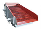Grizzly scalping feeder featuring robust bars for primary jaw crusher material pre-screening