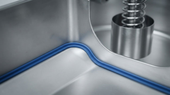 Close-up of hygienic dead-zone-free interior corner with blue FDA silicone seal and protected suspension spring inside Dahan food-grade sifter.