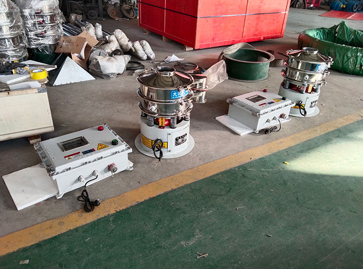Quality inspection and final testing of industrial vibrating sifter machines before shipping.