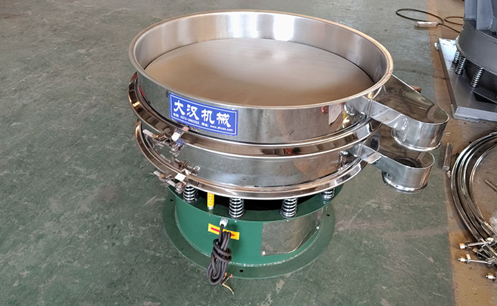 Double-layer rotary vibrating sieve with two discharge outlets for multiple size fraction separation.