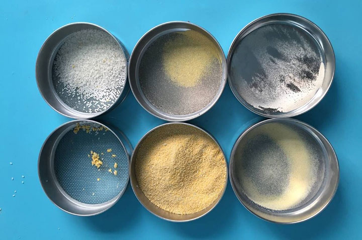 Six test sieves with different powder and granular samples on a blue background, illustrating how sieve openings match different particle size ranges.
